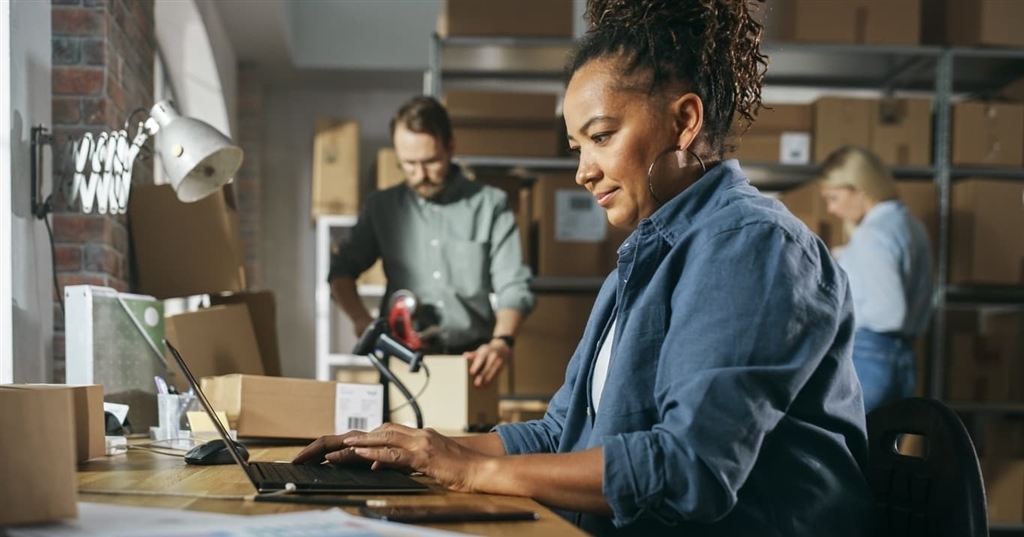 Woman working on a computer at a desk