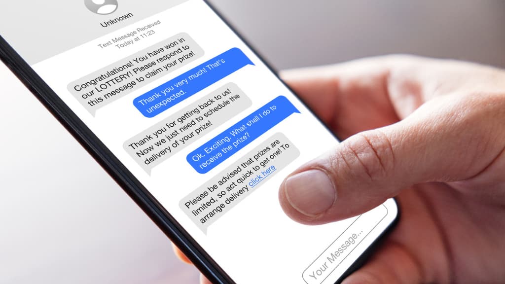 person receiving text messages from a scammer
