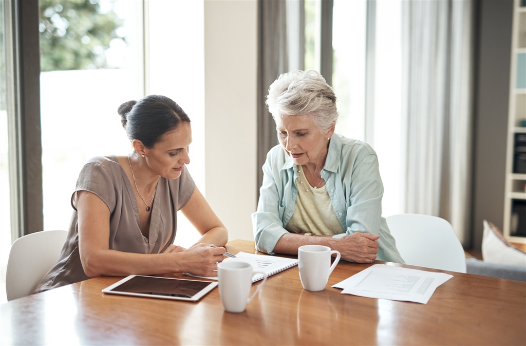 advisor going over paperwork with widow